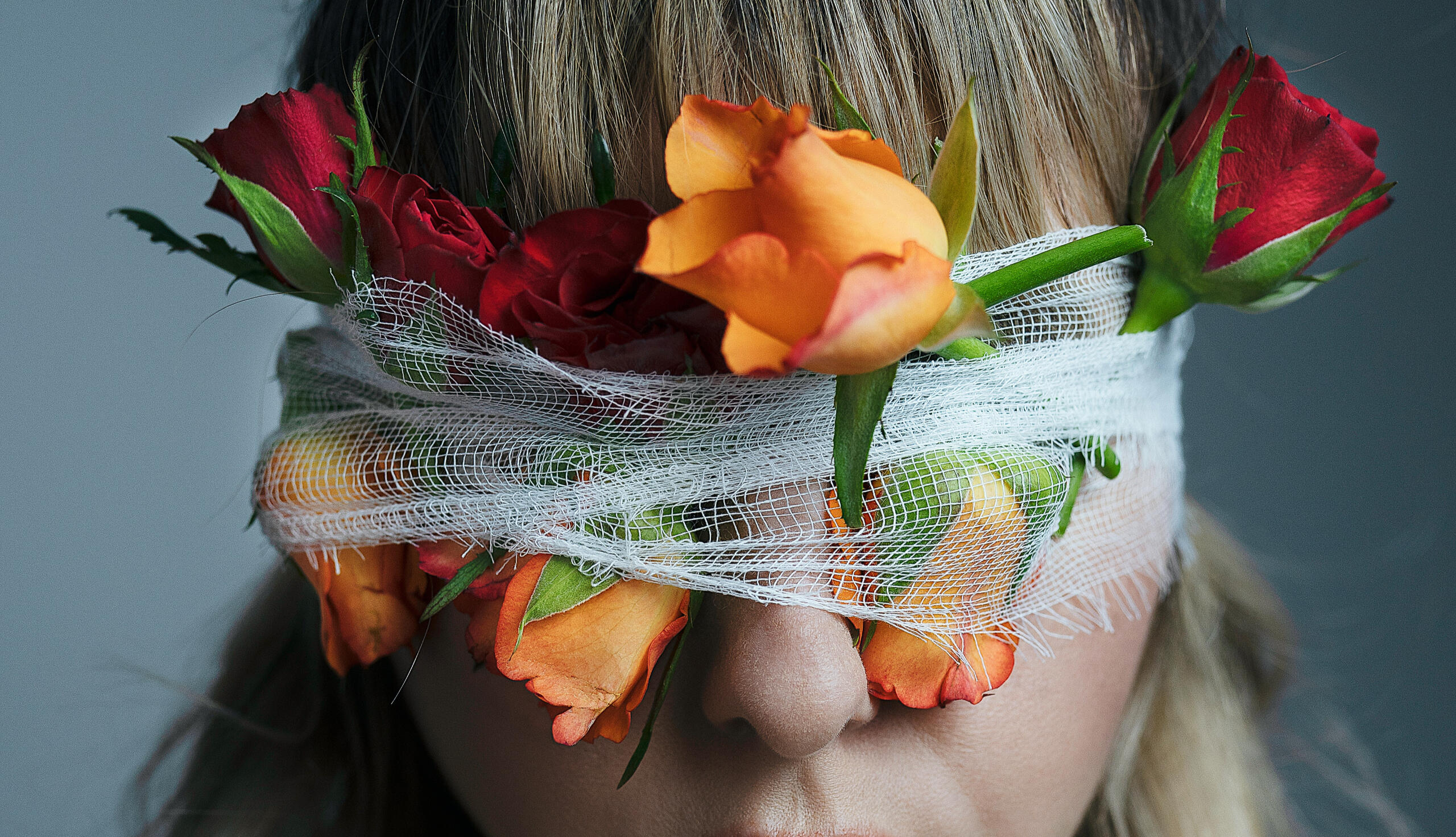 Ocular rosacea is a common cause of dry eyes, Photo by Monica Turlui: https://www.pexels.com/photo/unrecognizable-woman-with-blindfold-and-blooming-roses-7218408/